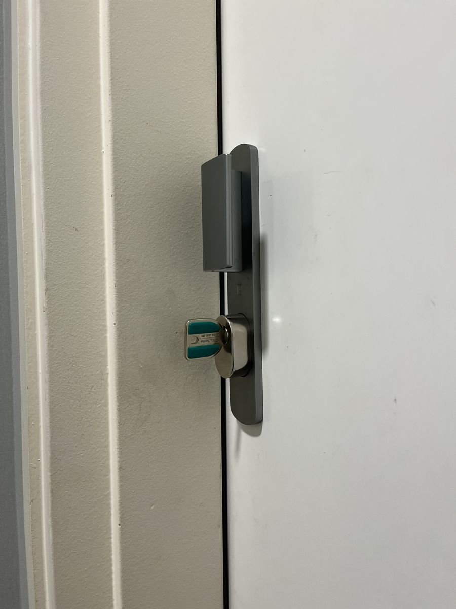 Protected cylinder installed — building door